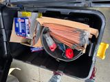 a box full of items in the back of a car