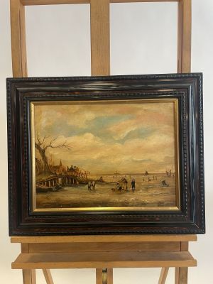painting on easel of a painting of a beach scene with a boat in the water