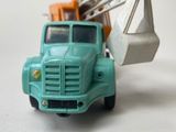 a toy truck with a crane on the back of it