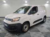 the white van is parked on a checkered floor in a room