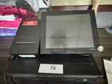 a laptop on a table with a price tag on it