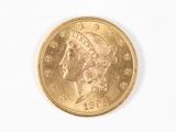 l'image d'une pièce d'or sur laquelle figure une tête de femme