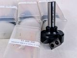 four plastic containers with different types of tools in them
