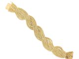a gold bracelet with a braid design