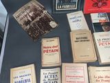 several books on display on a table in a glass case