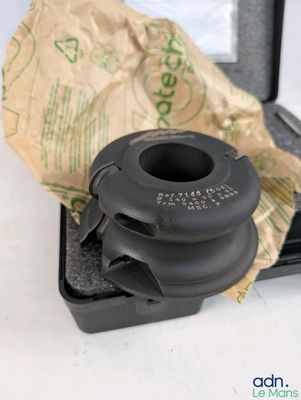 a small black object in a case on a table
