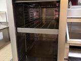 an oven that is sitting in the middle of a kitchen