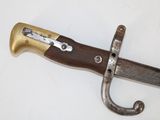 a knife that is laying on a white surface
