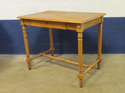 a small wooden table with a drawer on it