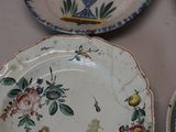 four plates that are sitting on a table