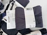 several pairs of men ' s socks and ties laid out on a table