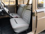 a small van with two seats and a steering wheel