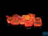 several pieces of orange fire oplite sitting on top of a black surface