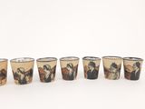 six shot glasses with a picture of a man and a woman on them