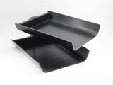 two black plastic trays on a white background with a white background