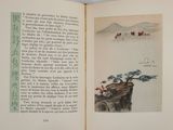 an open book with a picture of a boat on the water