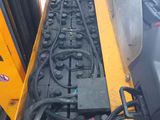 a yellow forklift with a bunch of wires attached to it