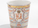 a cup that is sitting on a white table