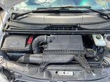 the engine of a car with its hood open and the hood up