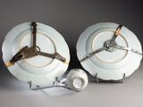 two plates that are sitting next to each other on a table