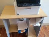 a printer that is sitting on top of a desk