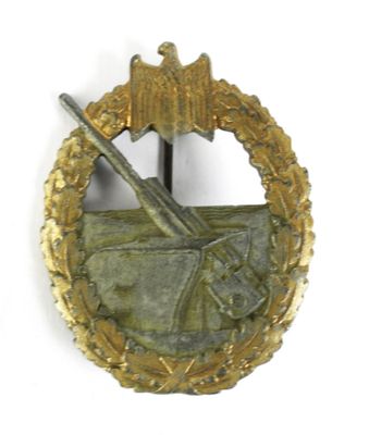 une image représentant un insigne sur lequel figurent un oiseau et un pistolet