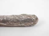a piece of meat that is sitting on a white surface