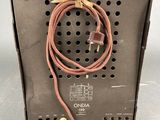 a close up of a metal box with a cord attached to it