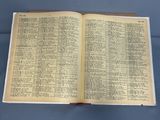 an open bible on a table with a blue background