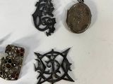 many different pieces of jewelry on a white surface