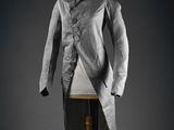 a grey jacket on a mannequin mannequin stand