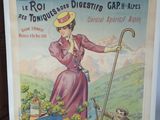 une vieille affiche représentant une femme en robe rose tenant une canne