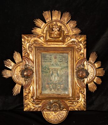 une photo représentant un cadre doré sur lequel figure une image de Jésus