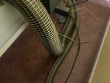 a hose that is connected to a computer on the floor