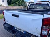 a white pick up truck parked on the side of the road
