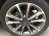 a close up of a tire on a car ' s rim