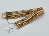 a gold chain bracelet and a gold chain bracelet