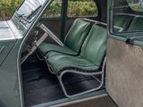 a green seat in the back of a small car