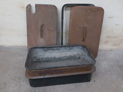 a dirty pan sitting on top of an old stove