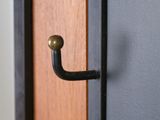 a close up of a door handle on a wooden door
