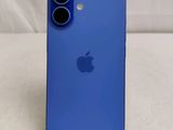 the back of a blue iphone 11 with a camera attached to it