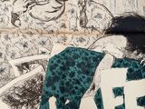 a poster on the wall of a cafe with a drawing of a woman sitting on a chair