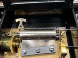 a music box with a musical instrument inside of it