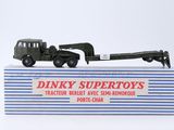 a toy truck with a trailer attached to the back of it