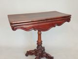 an image of a small table with a wooden top on a white background