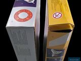 two boxes that are sitting side by side on a table