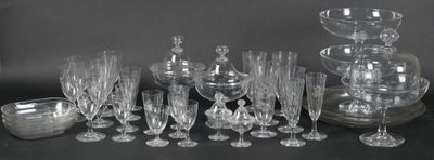 a lot of wine glasses and a vase on the table