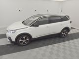 a picture of a white suv parked in a garage