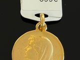 a close up of a gold medal with a price tag on it