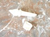 two toothbrushes sitting on a marble counter top